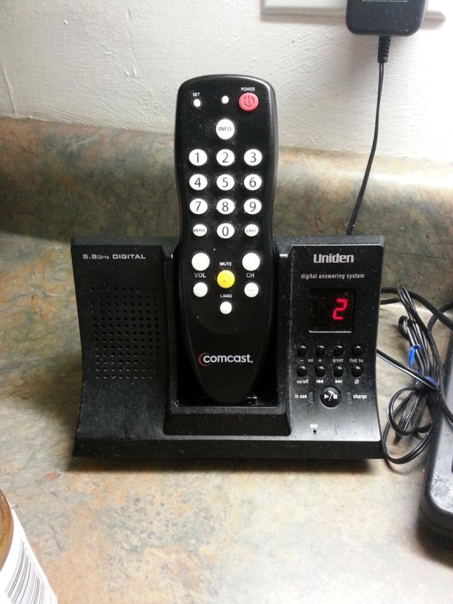 grandparents with television remote in phone stand grandparents failing at technology