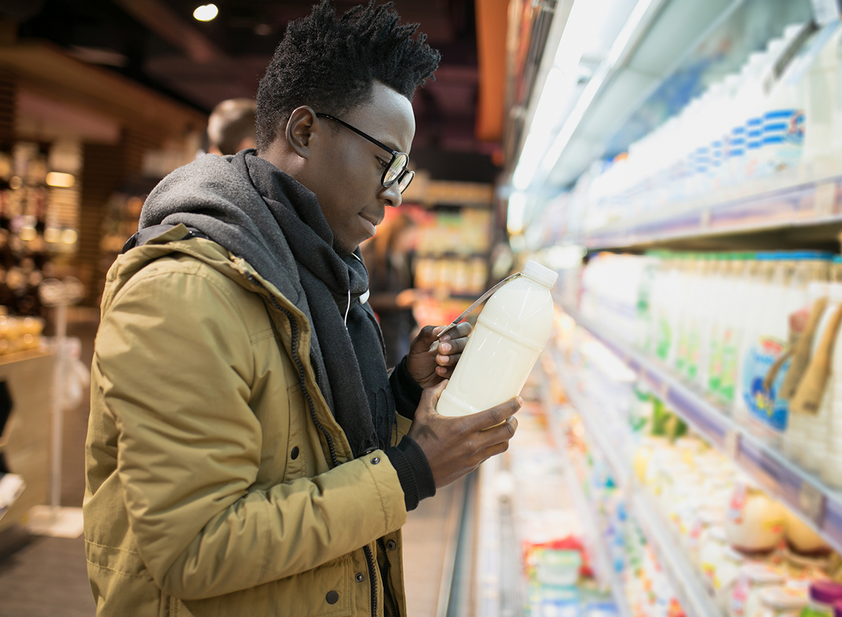 person examines nutrition label