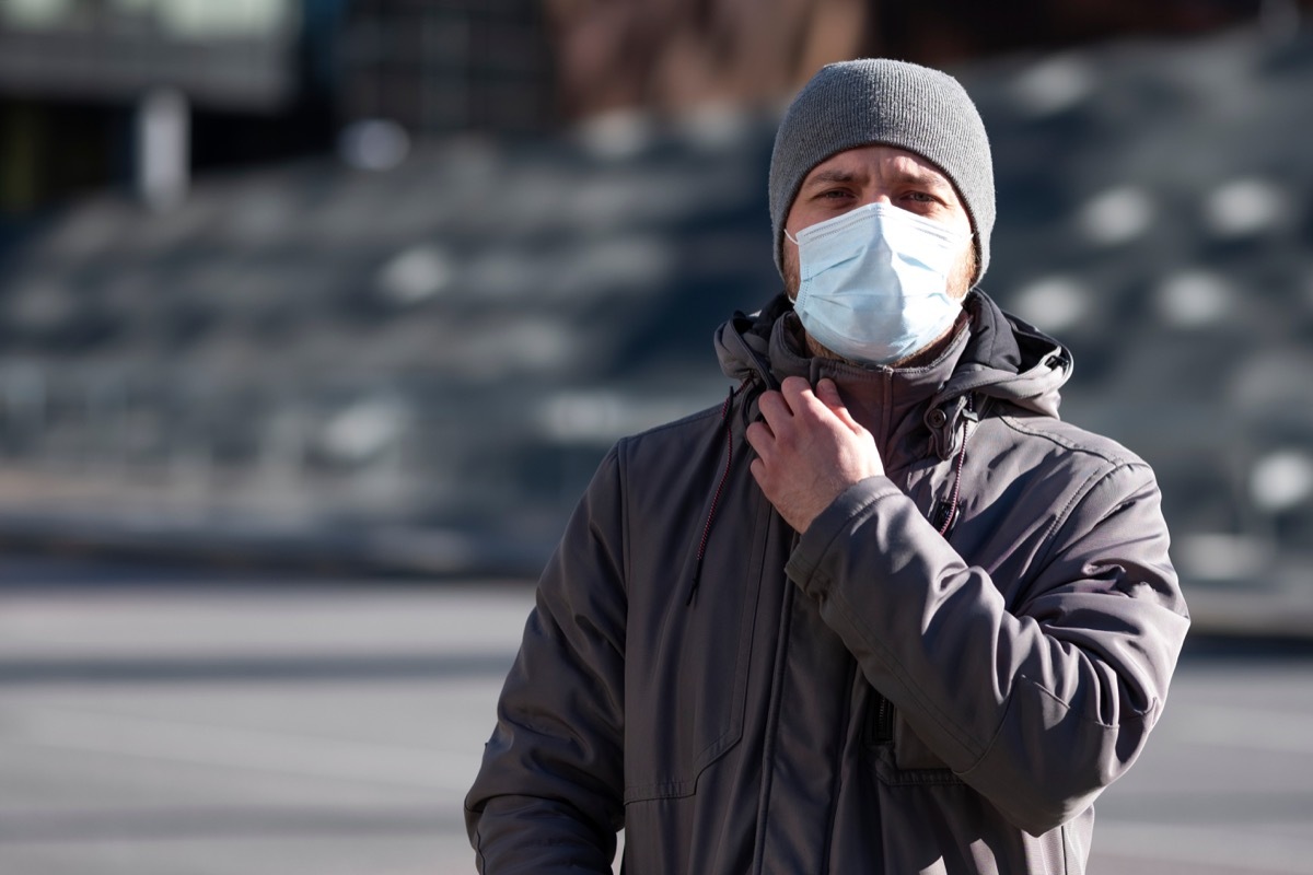 Man wearing a mask outside