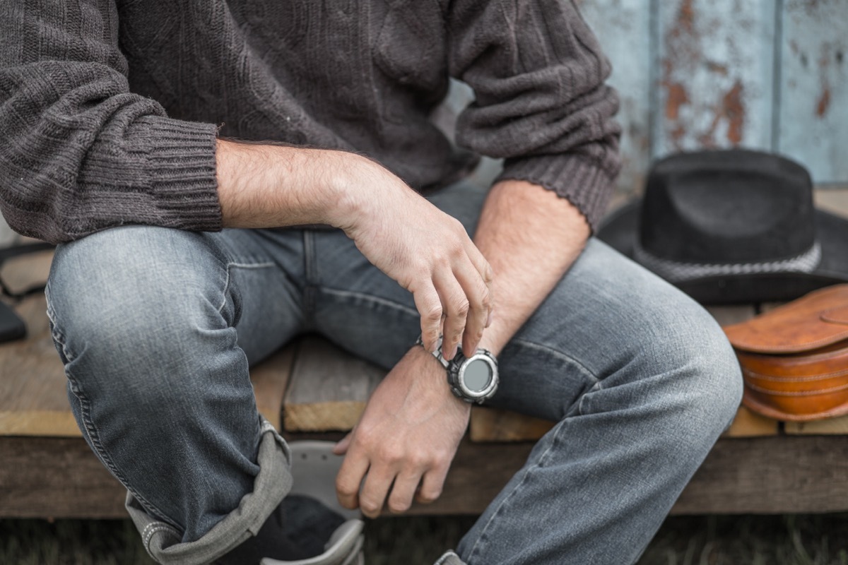 man wearing light wash denim