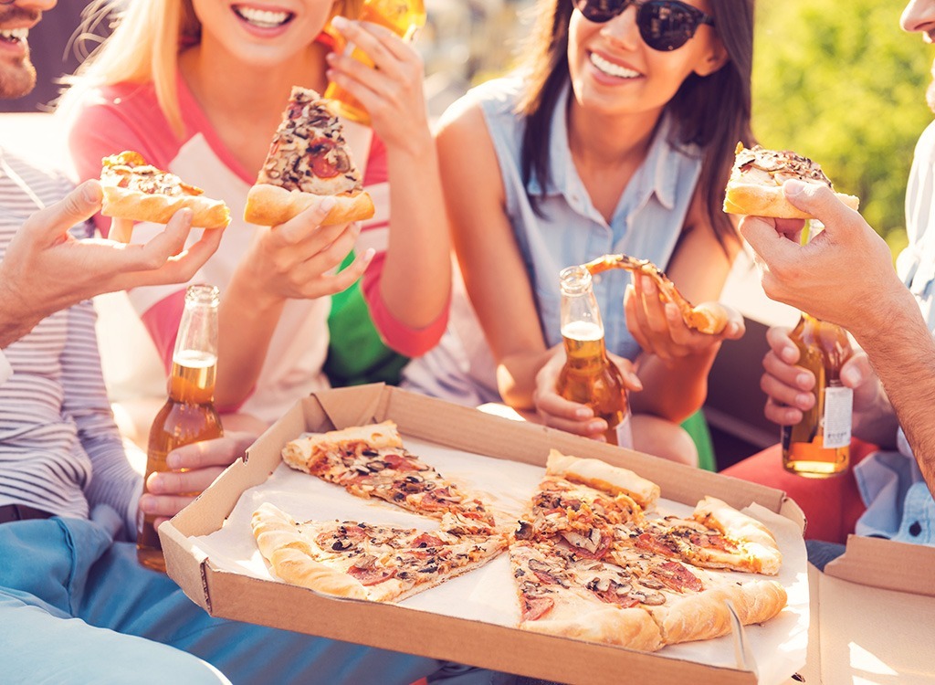 People sharing a pizza