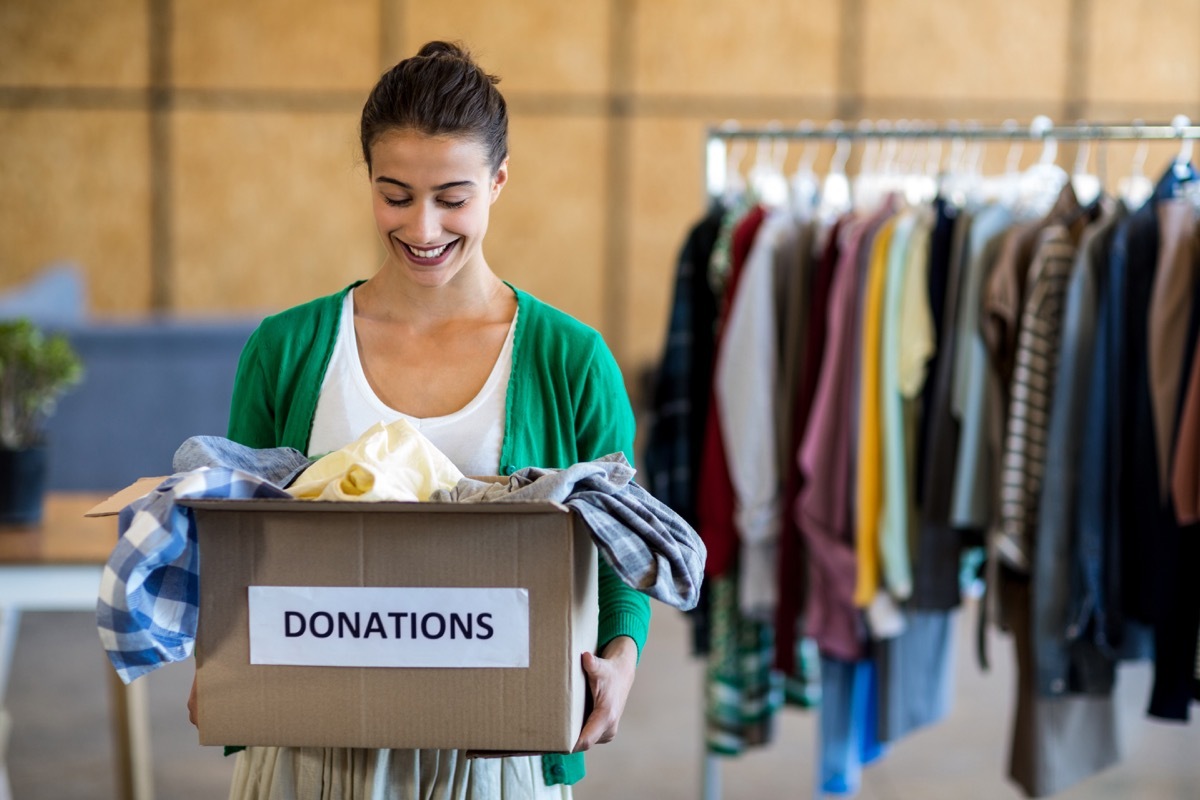 Woman donating box of clothes