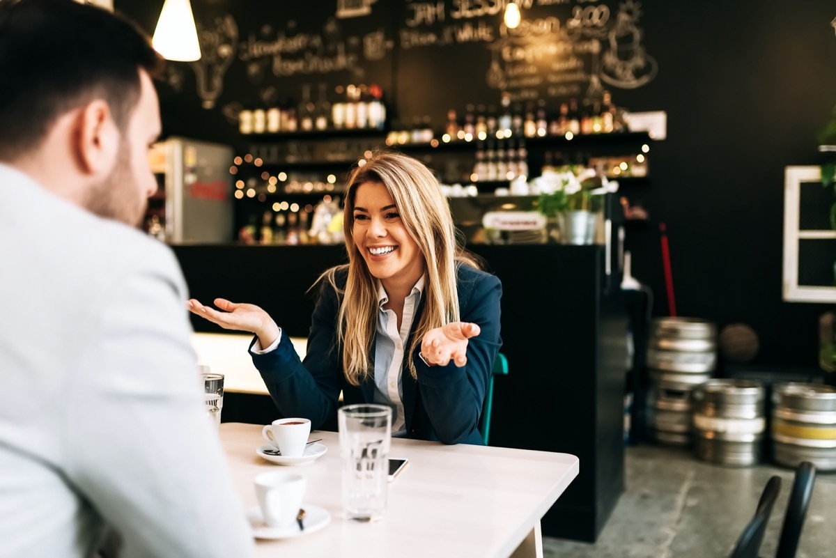 Young man and woman on first date in bar