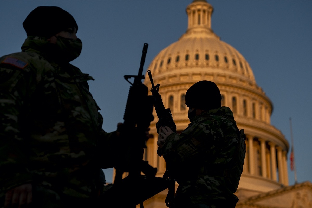 national guard members receiving long guns outside capitol building