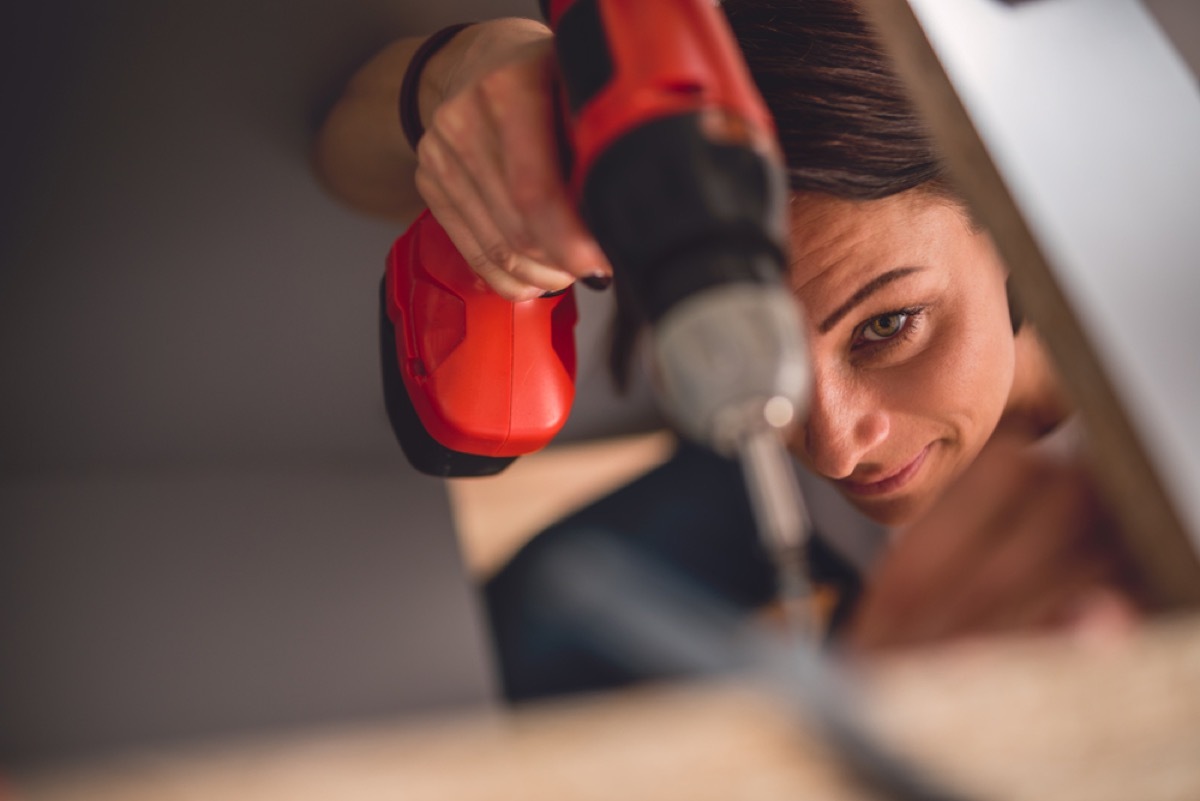 closeup of woman drilling