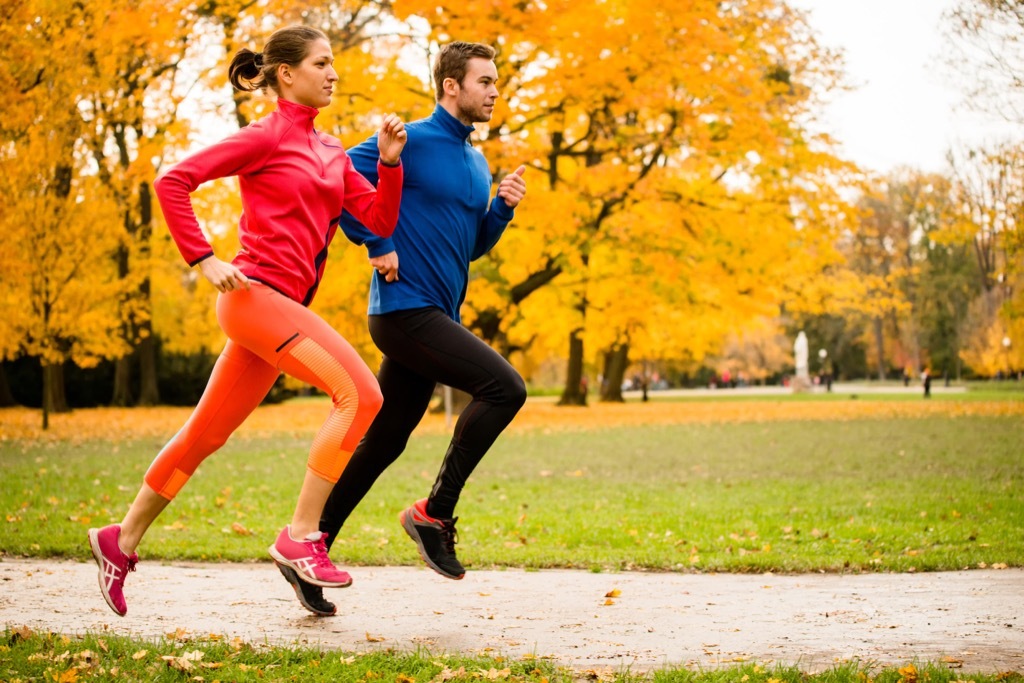 couple running in fall