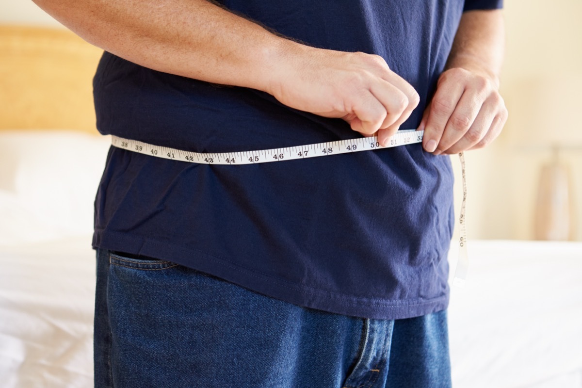 Man Measuring His Waist