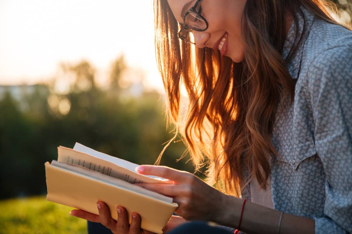 i love you quotes: woman in park reading a book