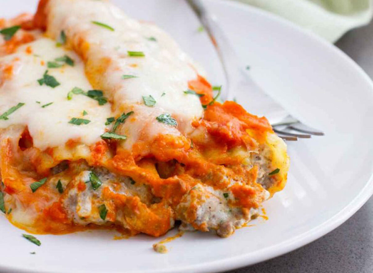 ground beef stuffed manicotti on white plate taste and tell recipe