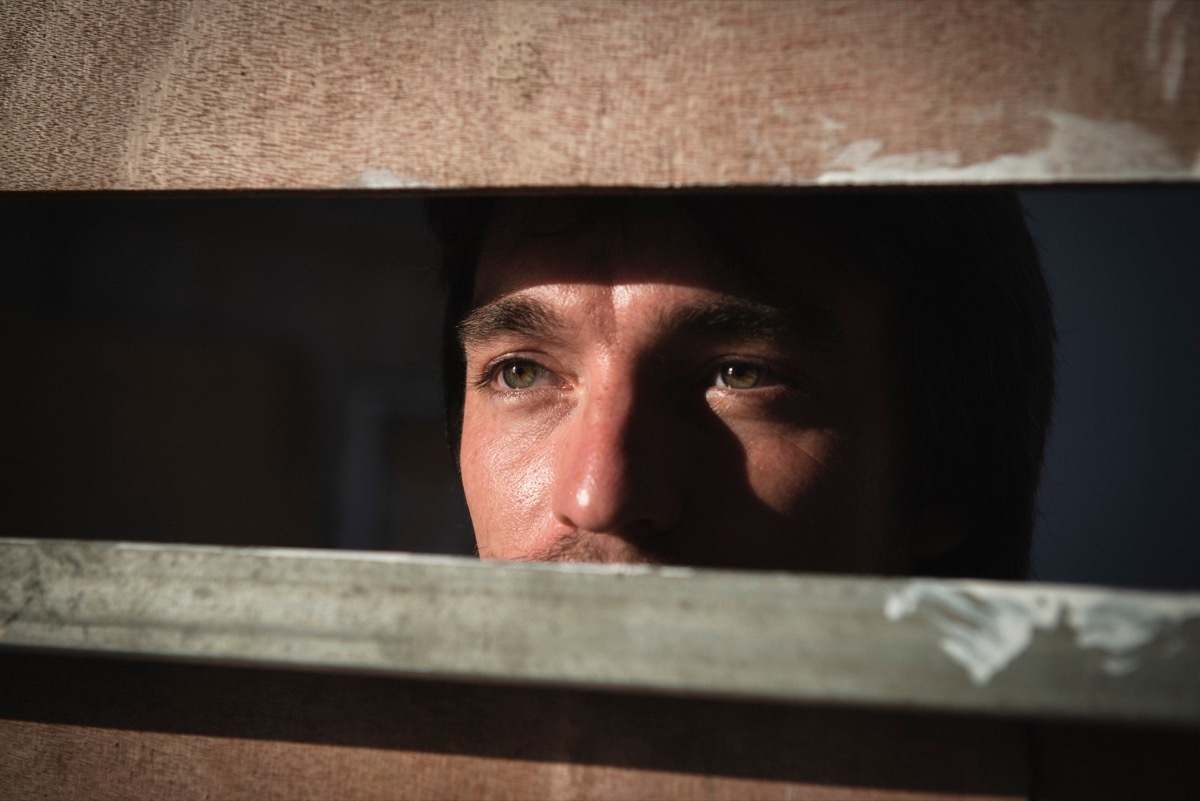 man staring through fence, astonishing facts