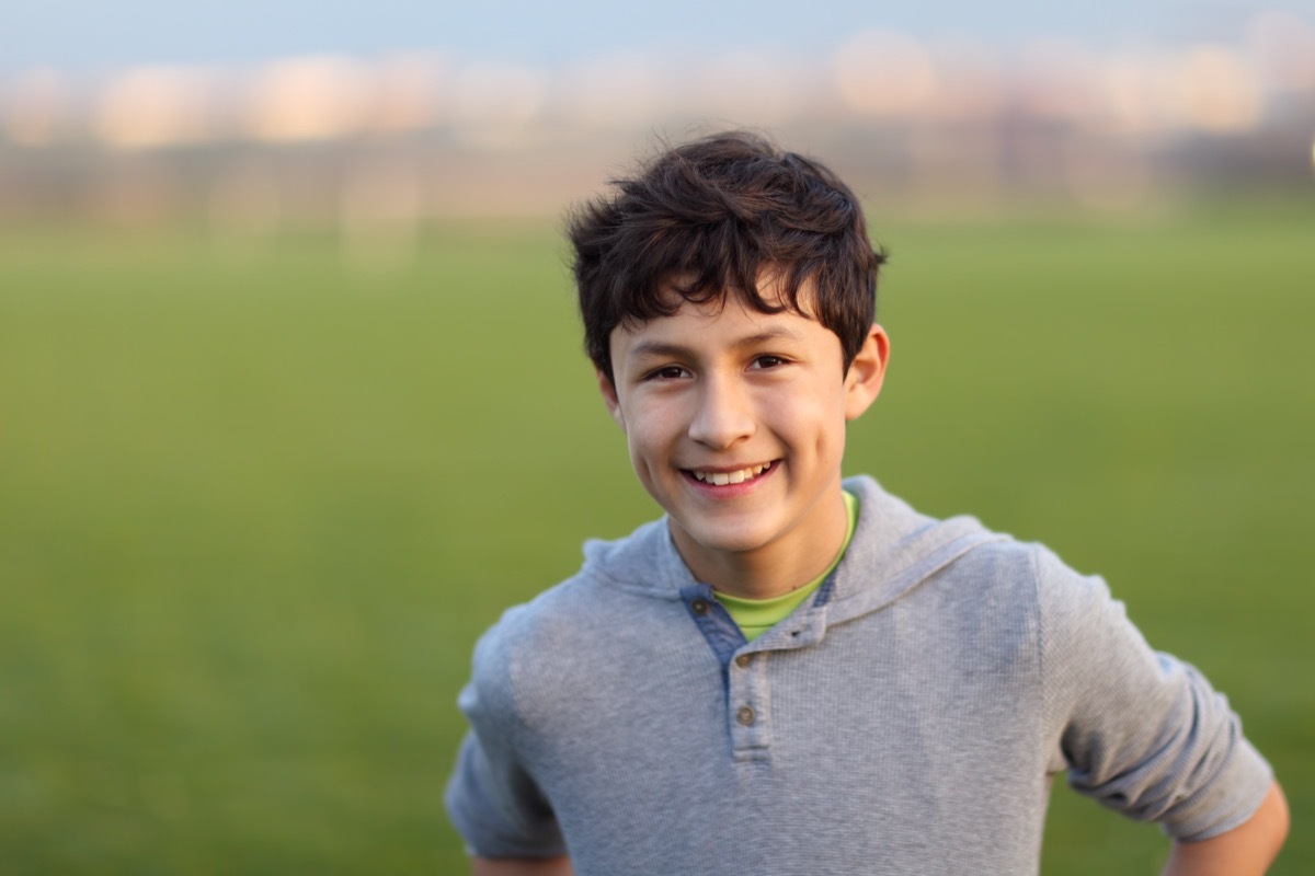 boy smiling, middle child