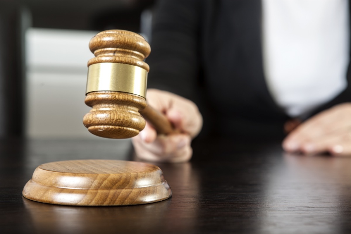 Caucasian woman holding gavel