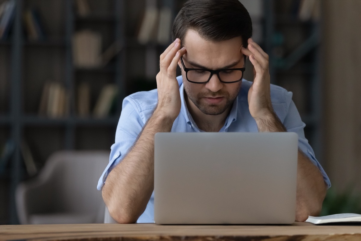 Frustrated Man at His Laptop