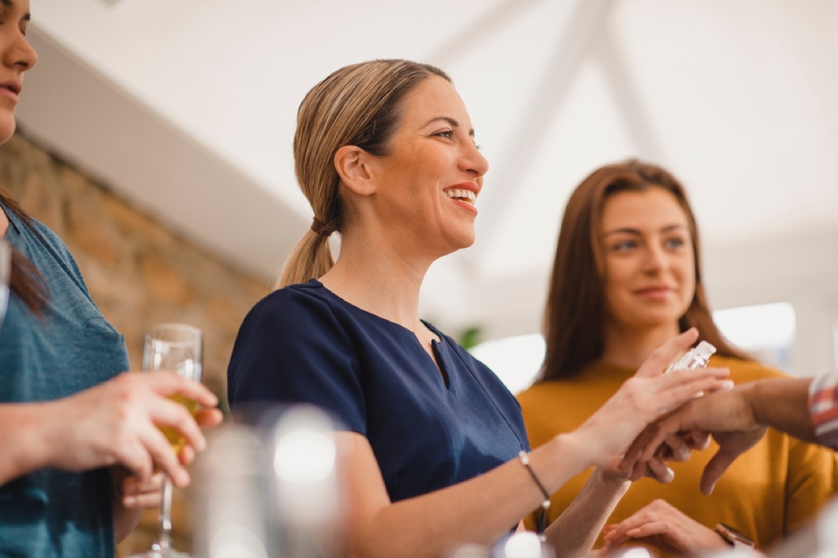 women drink champagne while shopping