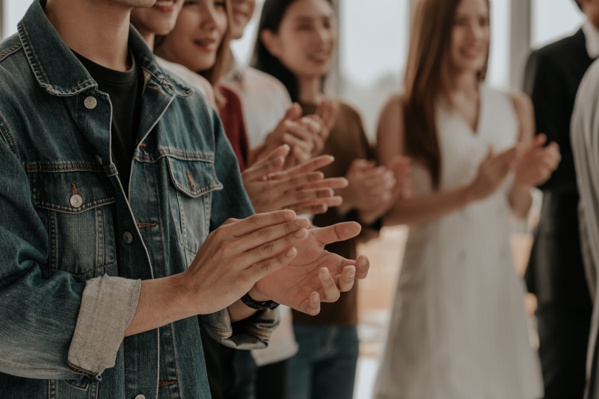 group clapping together