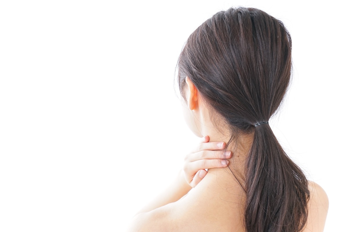 Woman with her Hands on her Neck, subtle symptoms of serious disease