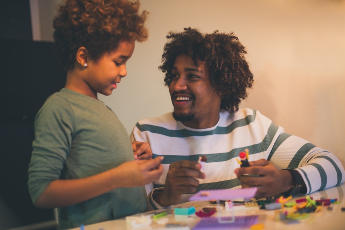 dad and son playing with legos