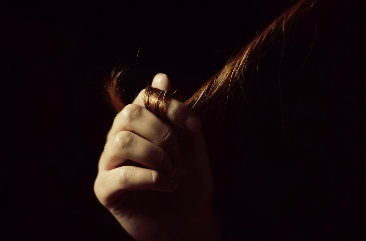 woman twirling hair around