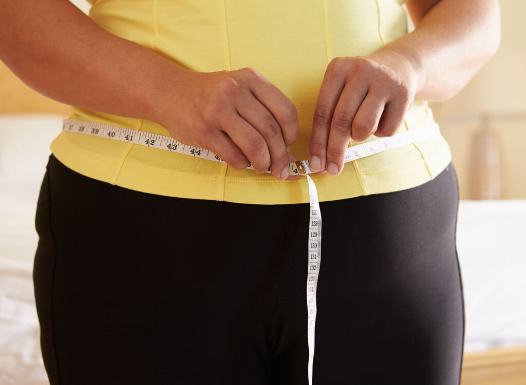 Woman measuring waist