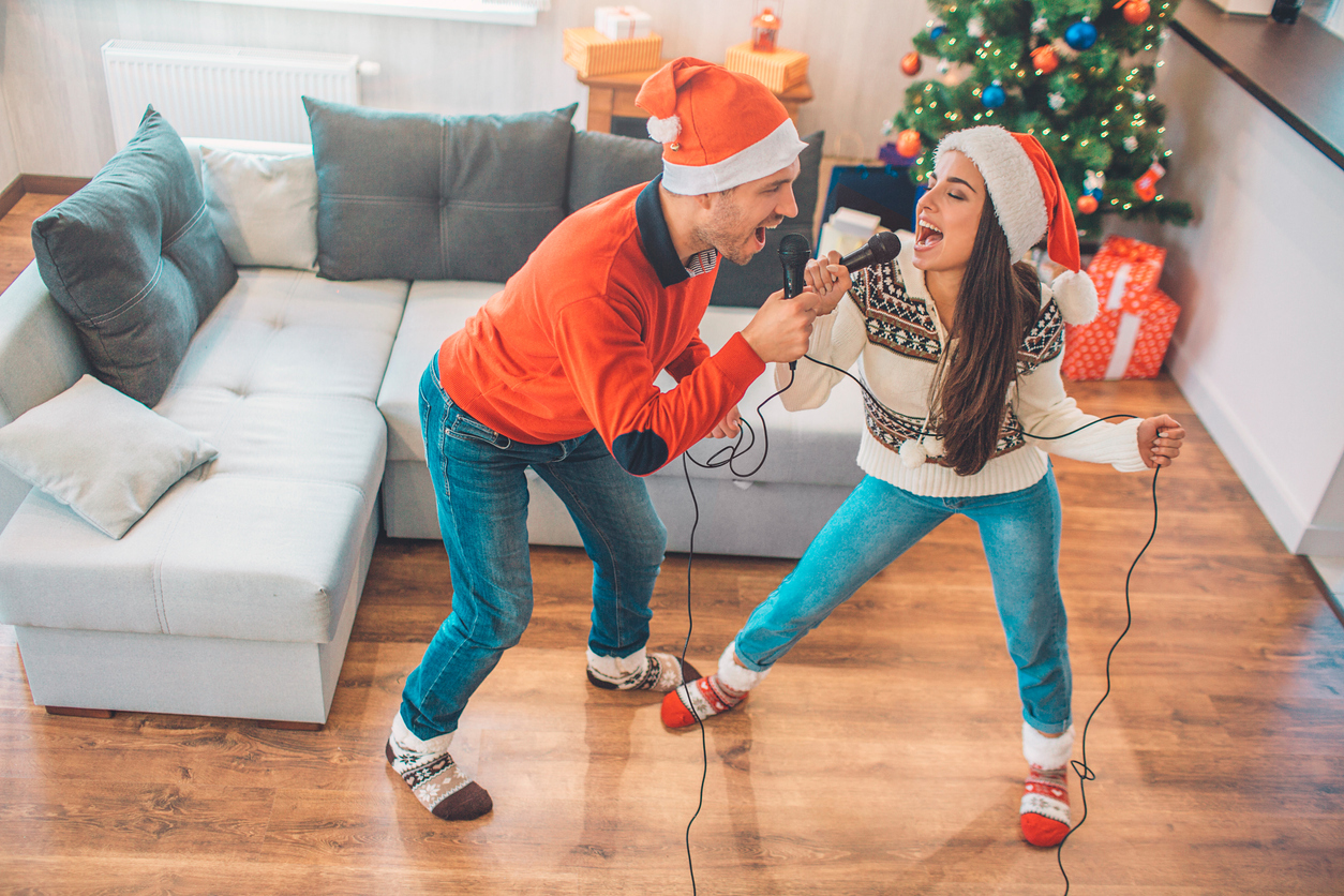 young couple singing christmas songs together