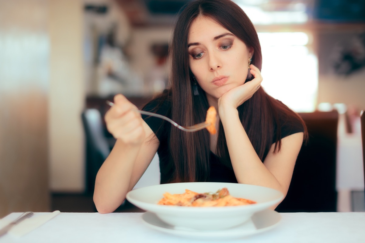 woman starring at her food