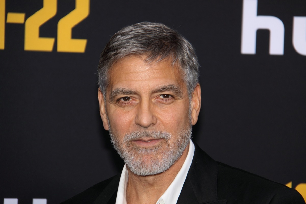 George Clooney wears a black suit at the premiere of 