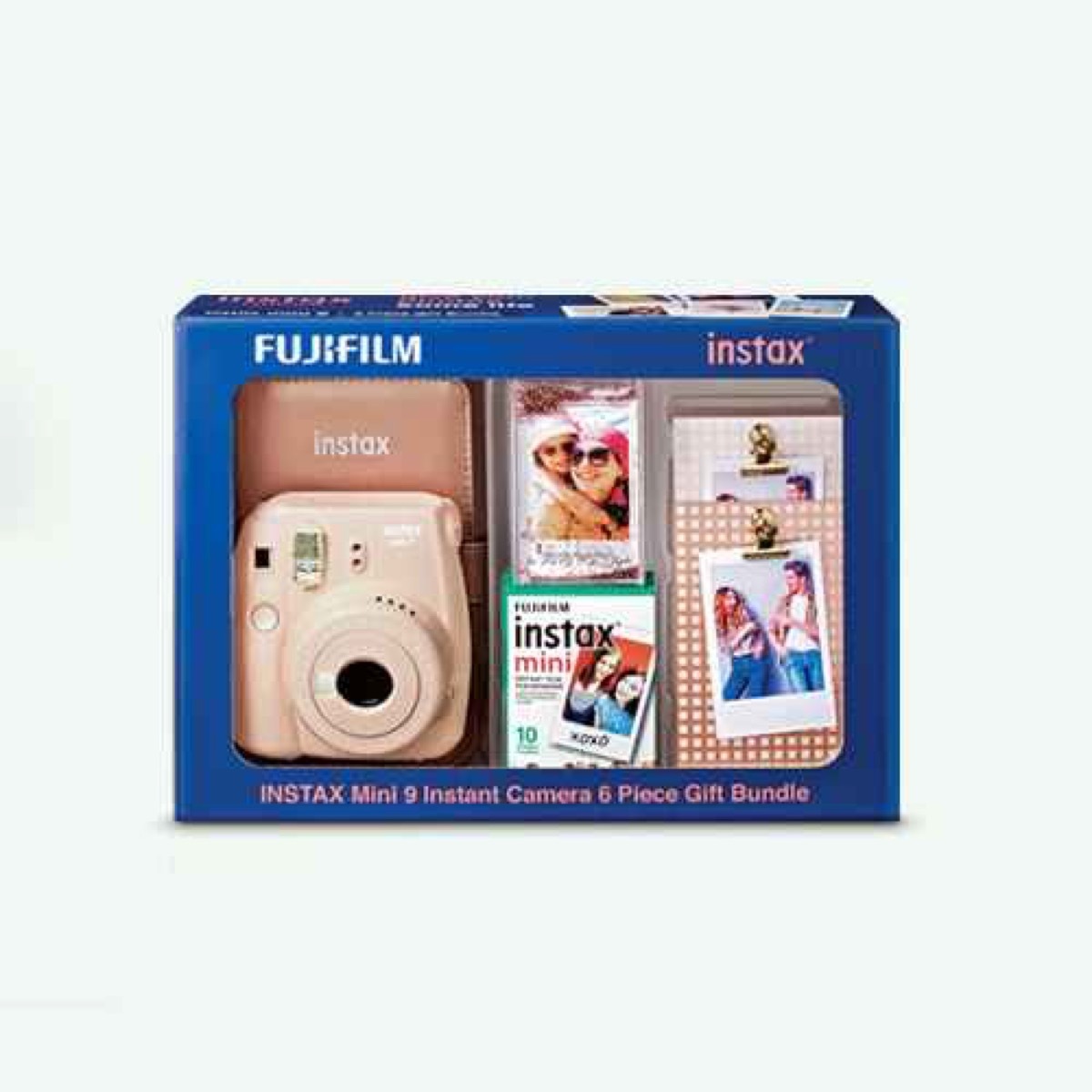 pink fujifilm instax camera and film