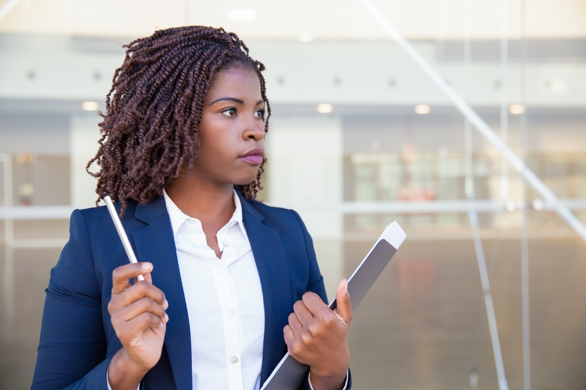 woman outside office waiting