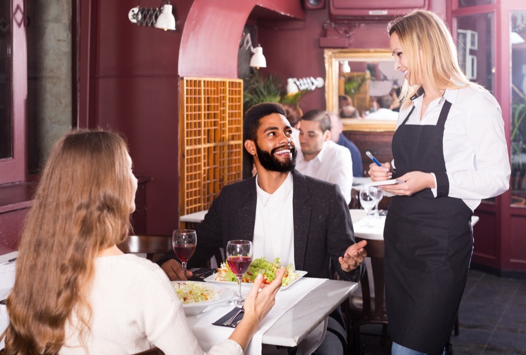 man talking to his waitress