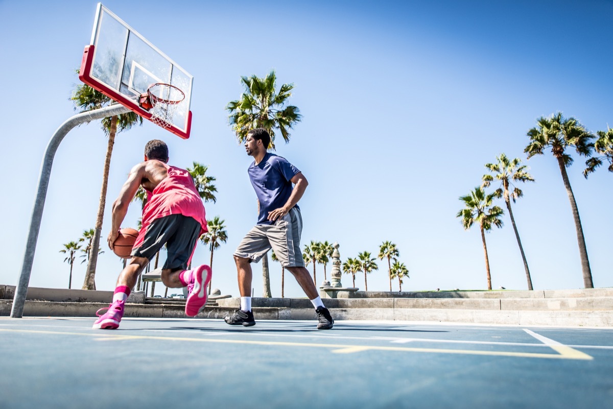 Men playing outdoor basketball