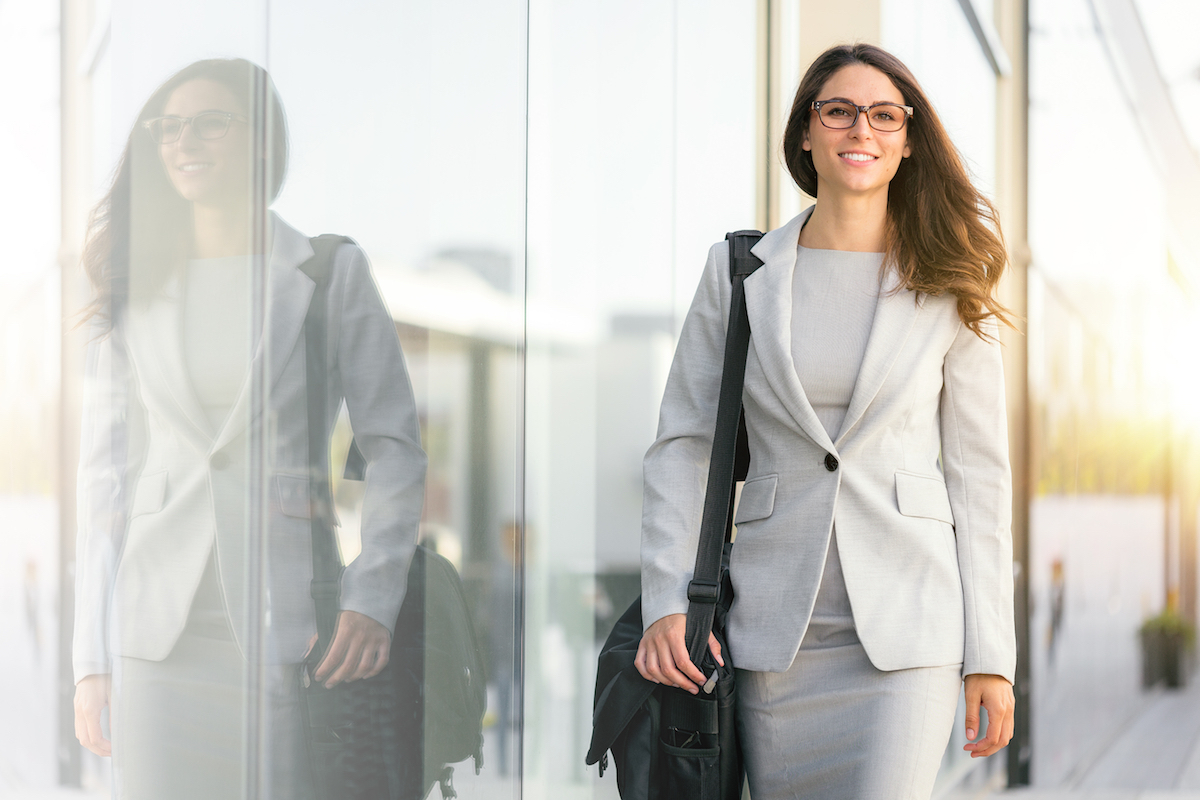 Active lifestyle of mixed ethnicity career business woman walking to work place office