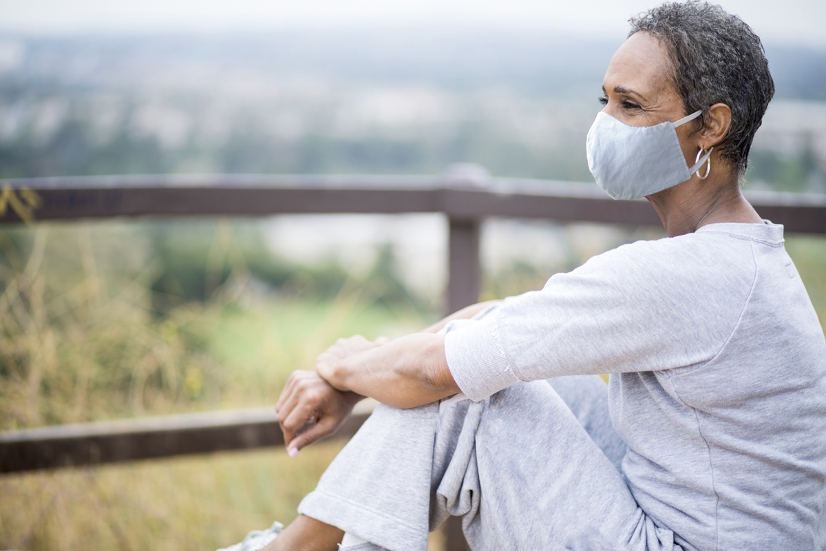 A portrait of a beautiful senior Woman wearing a mask