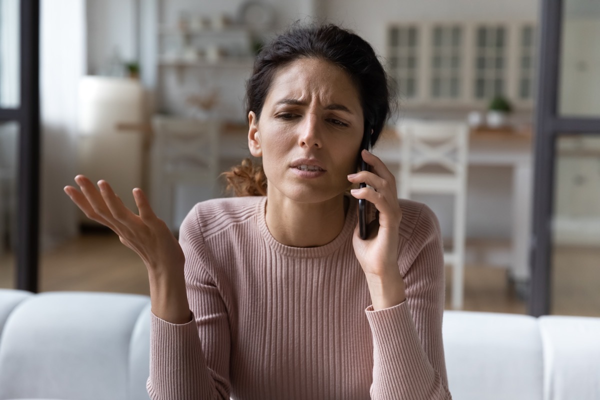 Woman on her phone confused