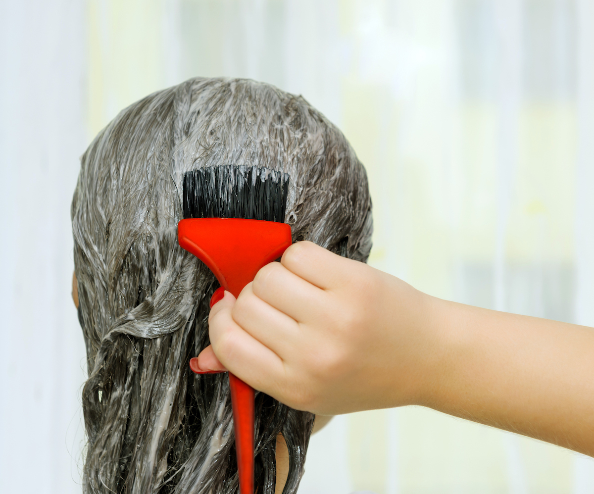 rear view of woman head dying hair.