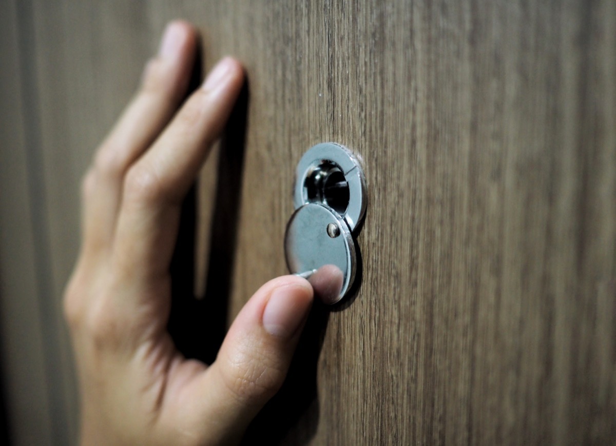 looking through peephole on door