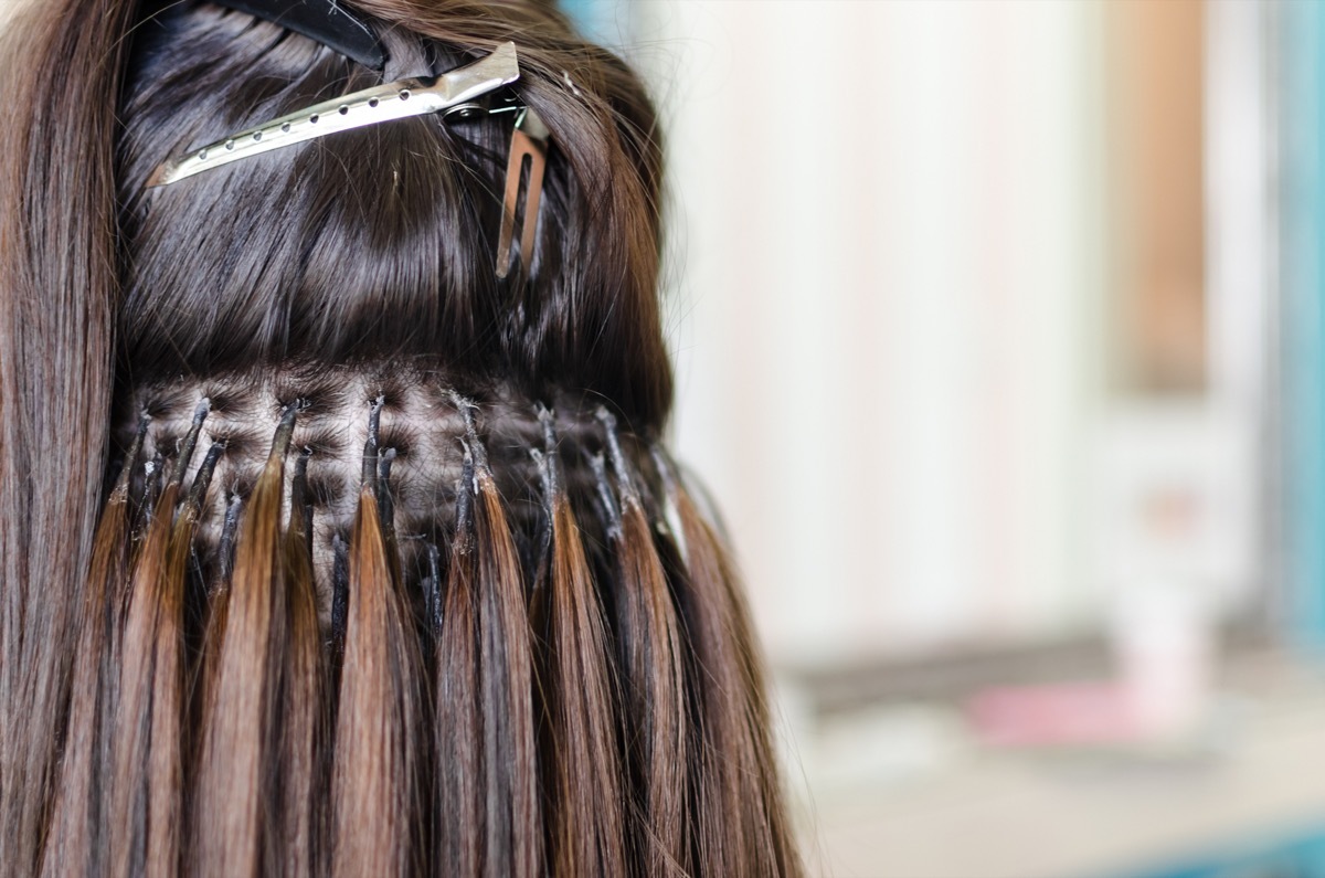 Woman Getting Hair Extensions