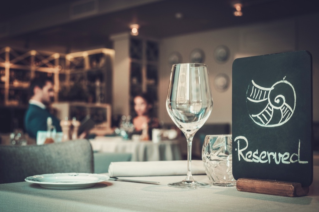 a reserved table sign in a fancy restaurant