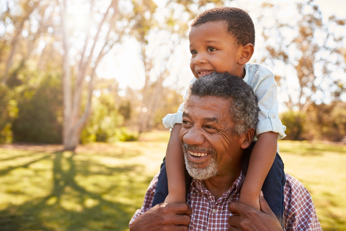 Grandpa with grandson on shoulders