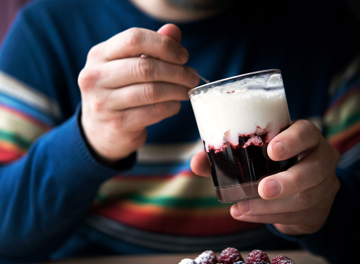 man eating yogurt