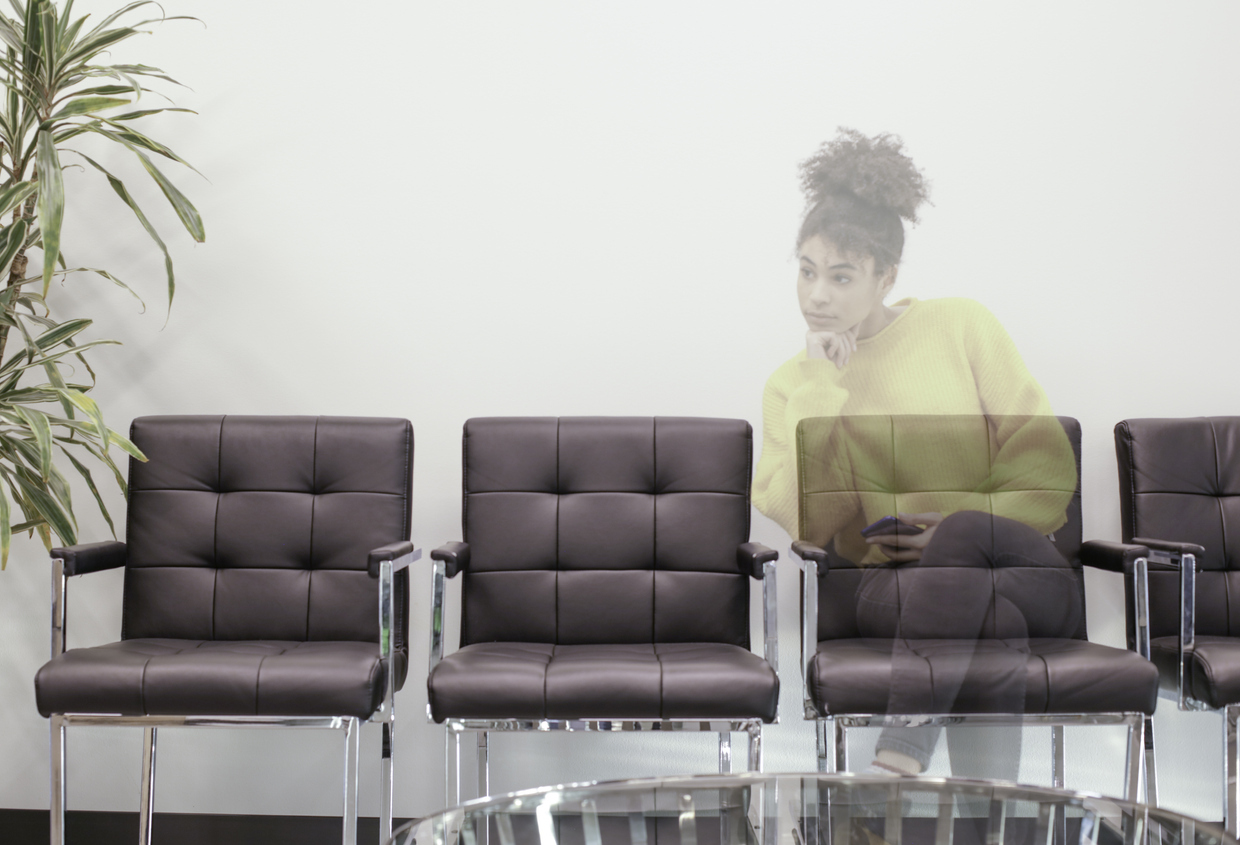 young invisible woman sitting alone