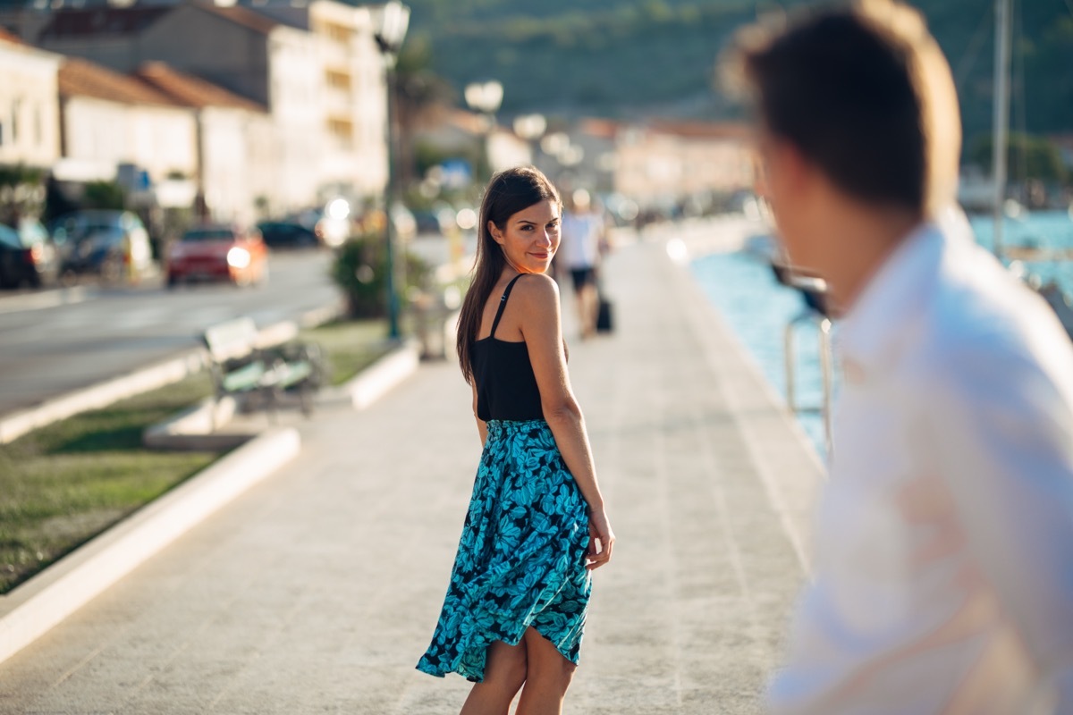 man complimenting a pretty woman on the street