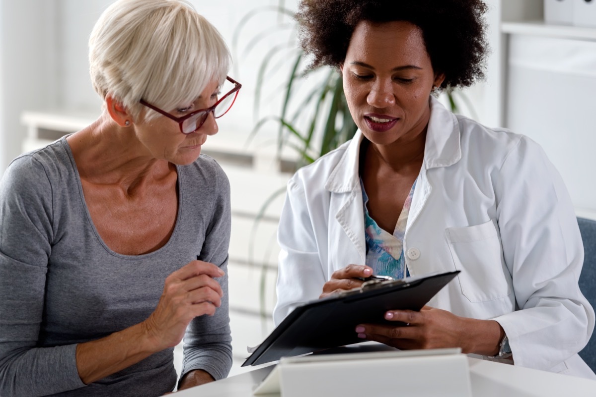 Senior woman talking to doctor