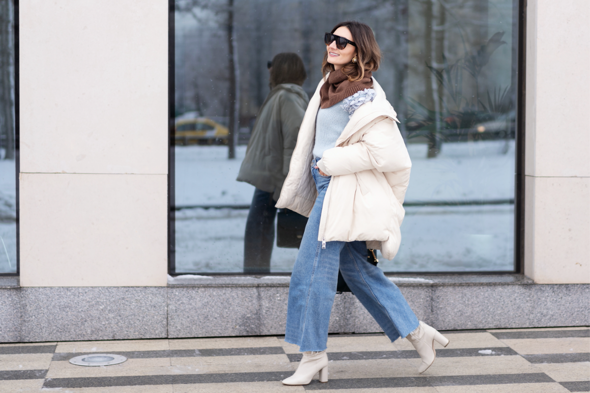 woman wearing heeled boots and jeans