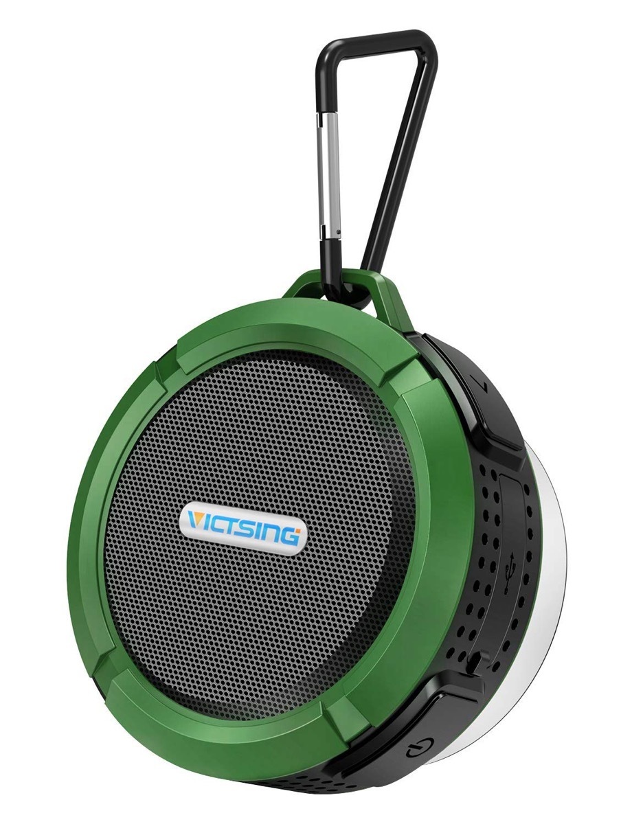 green bluetooth speaker on a carabiner