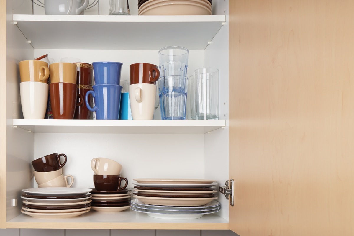 cabinet full of mugs and dishes