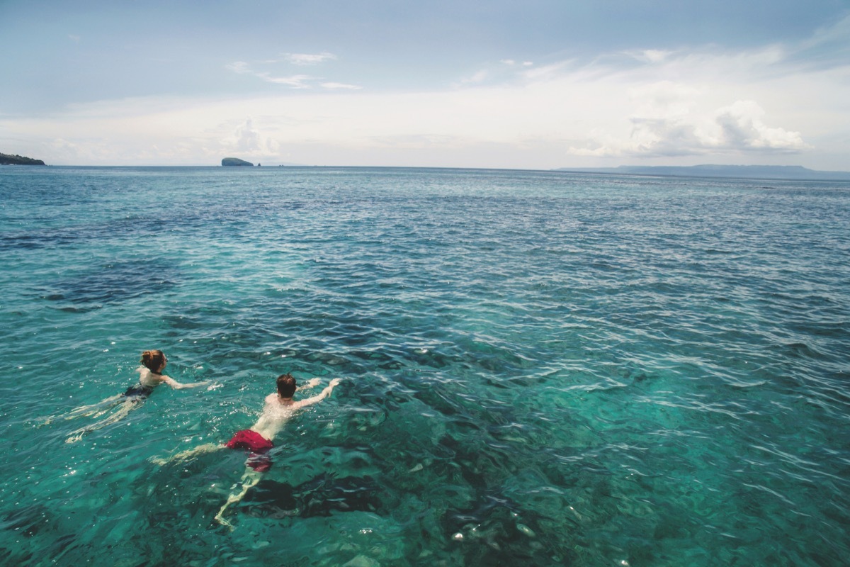 people swimming in the ocean