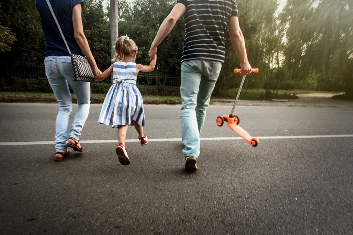 parents crossing street with daughter, things you should never lie to kids about