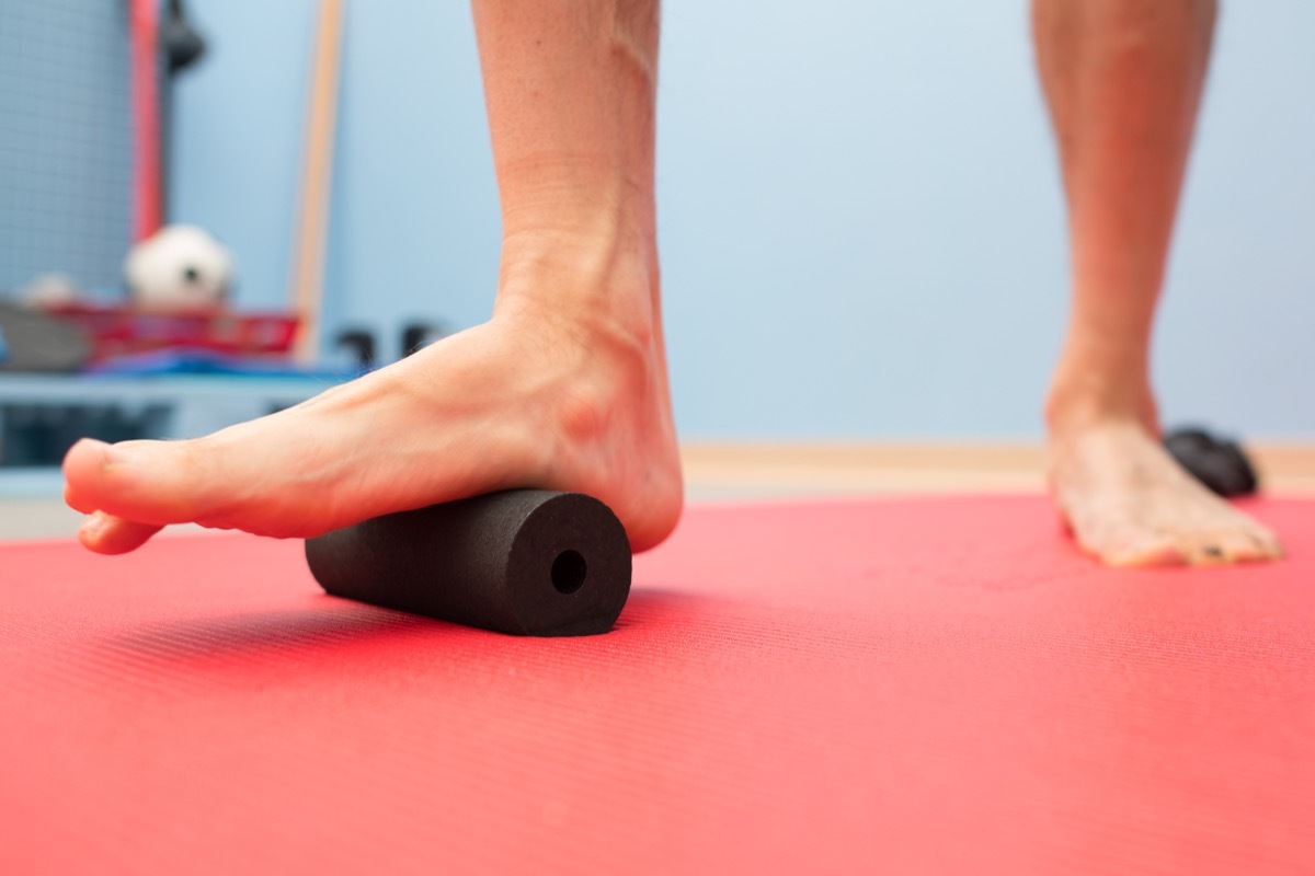 Foam roller plantar fascia treatment in physiotherapy studio