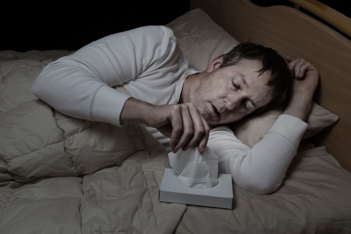 Man in Bed with Night Sweats Surprising Symptoms