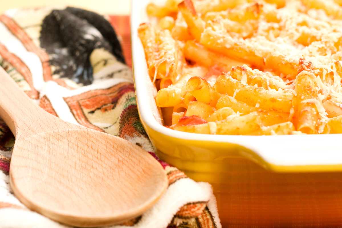 Baked ziti in colorful yellow baking dish